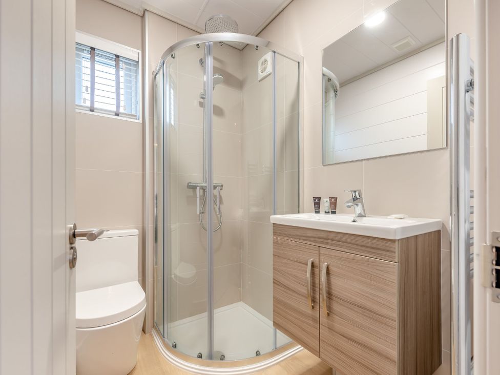 A bathroom with a shower and a toilet at Epic Spa (Roof Terrace) in Laugharne