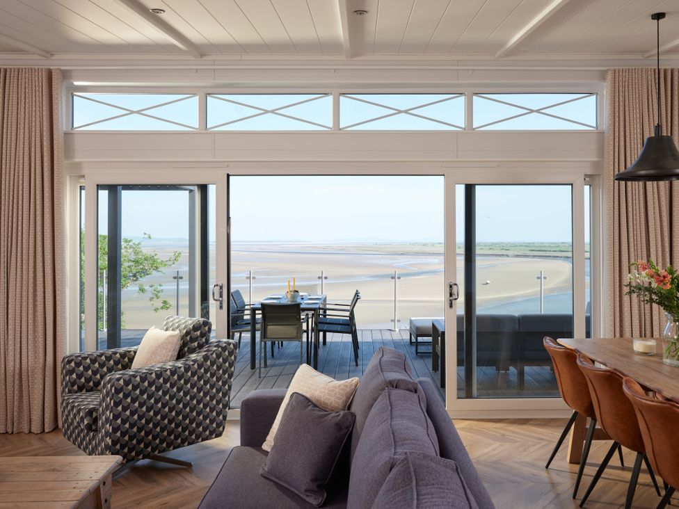 A living room with a view and furniture at Canto Spa (pet) Laugharne