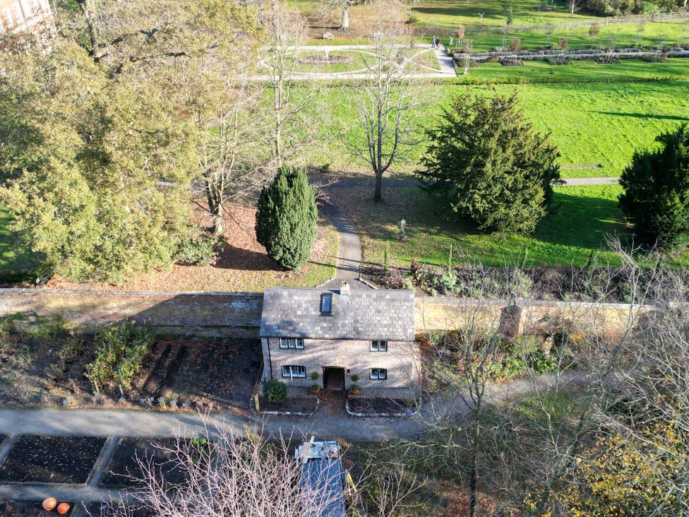 A cottage with garden and pathway at The Gardeners Cottage at Lytham Hall Lytham St. Annes