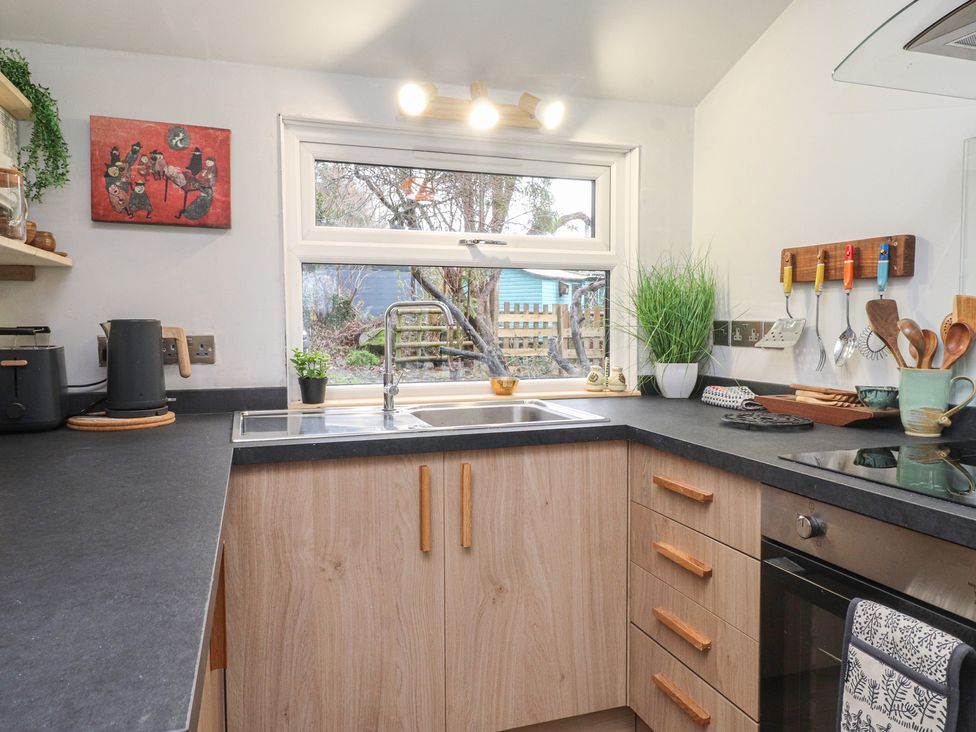A kitchen with a sink and countertop at 20 Chatham Log Cabins Caernarfon