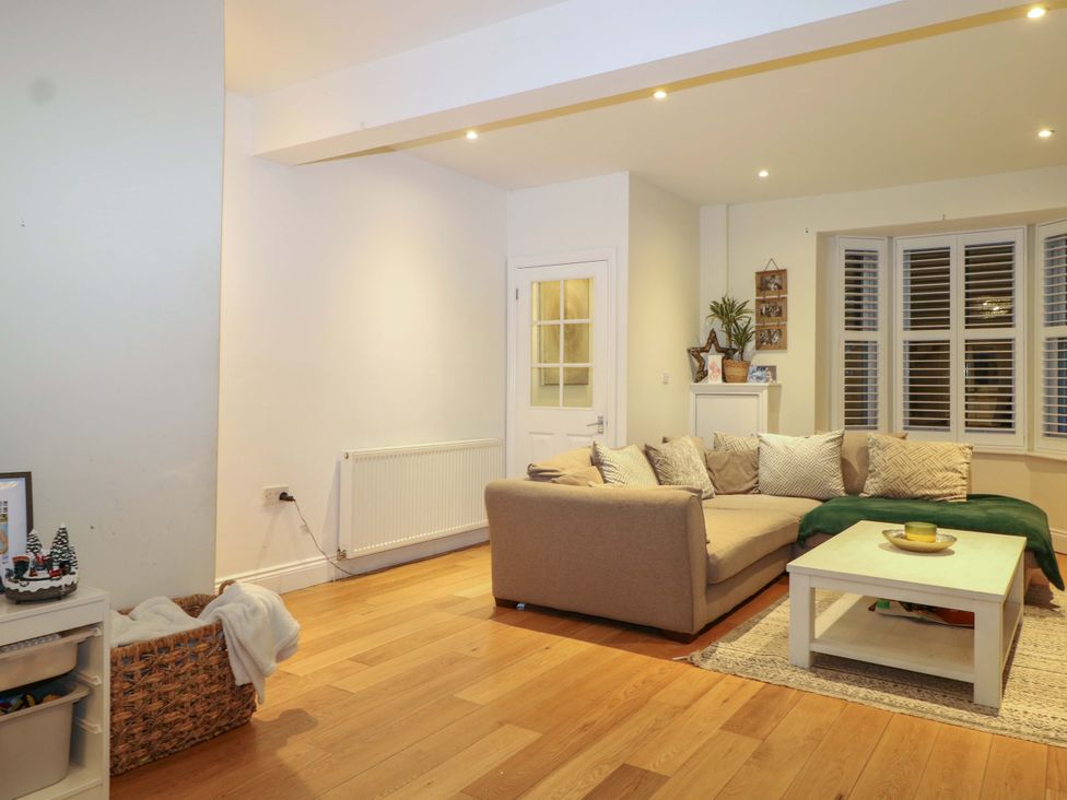 A living room with a sofa and coffee table at 213 Gordon Avenue in Camberley