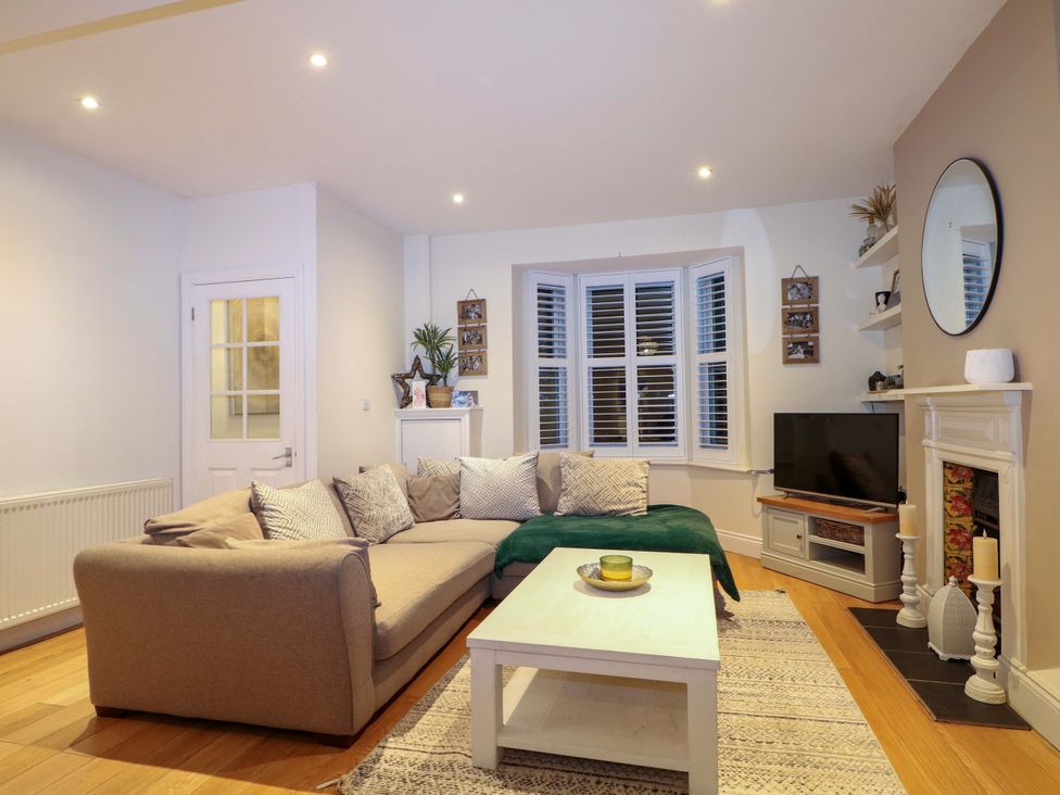 A living room with a sofa and coffee table at 213 Gordon Avenue in Camberley