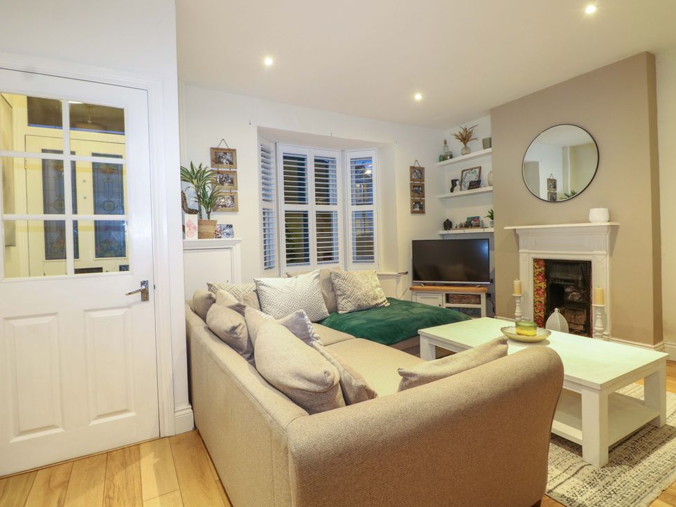 A living room with a sofa and coffee table at 213 Gordon Avenue in Camberley
