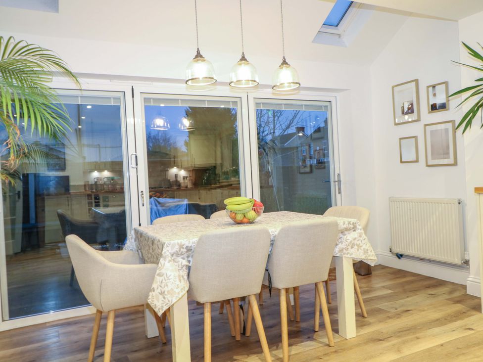 A dining room with a table and chairs at 213 Gordon Avenue in Camberley