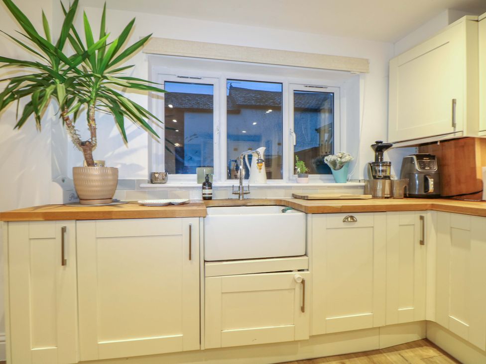 A kitchen with a sink and countertop at 213 Gordon Avenue in Camberley