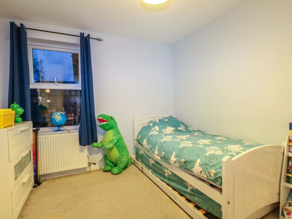 A bedroom with a bed and a globe at 213 Gordon Avenue Camberley