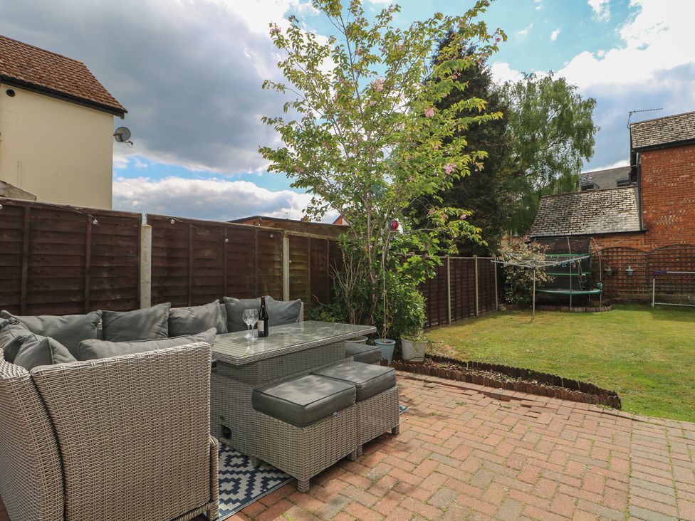 A garden with seating and a trampoline at Gordon Avenue in Camberley