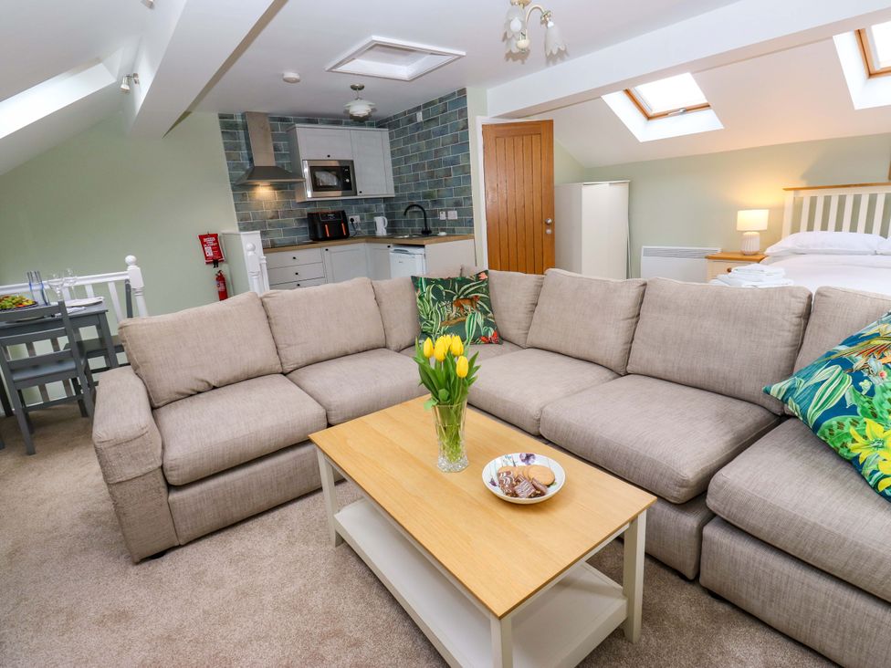 A living room with a sofa and coffee table at Chapel House Annex, Scholes