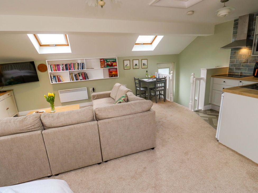 A living room with a sofa and television at Chapel House Annex in Scholes