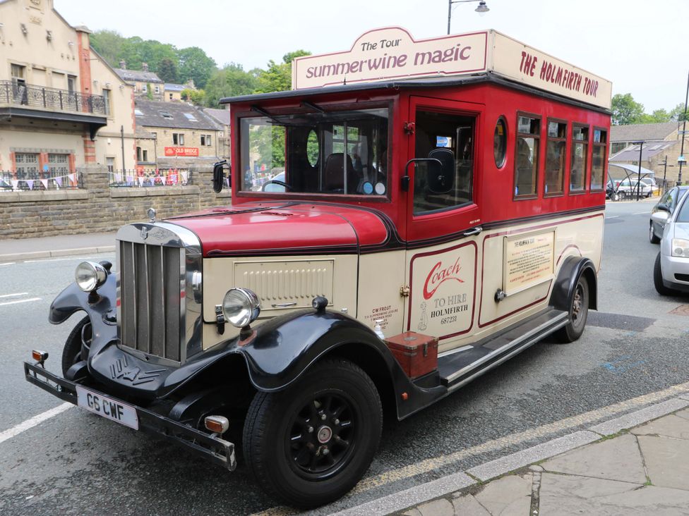 A vintage bus parked on the street at Chapel House Annex in Scholes