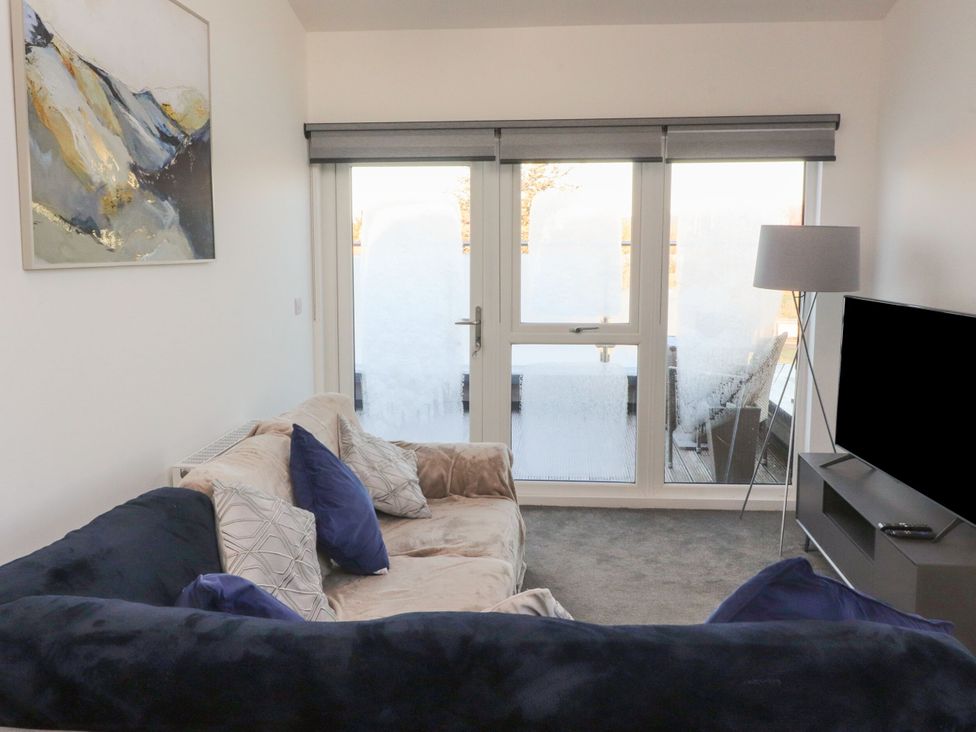 A living room with a sofa and television at Apartment 20, River View in Preston