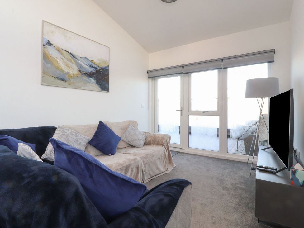 A living room with a sofa and television at Apartment 20, River View in Preston