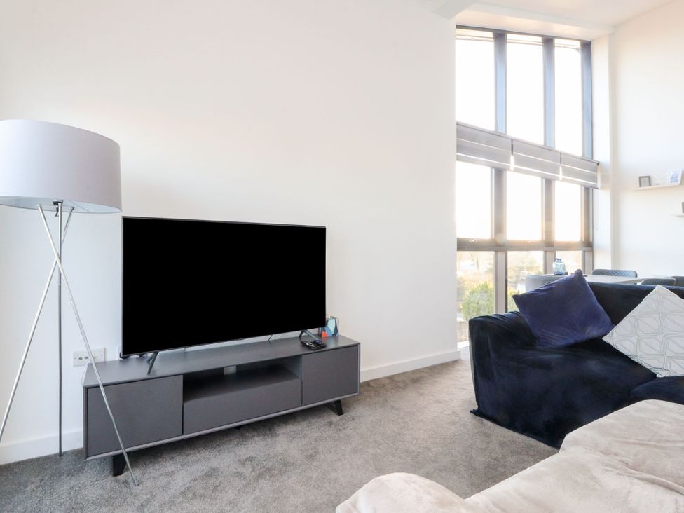 A living room with a television and sofa at Apartment 20, River View in Preston