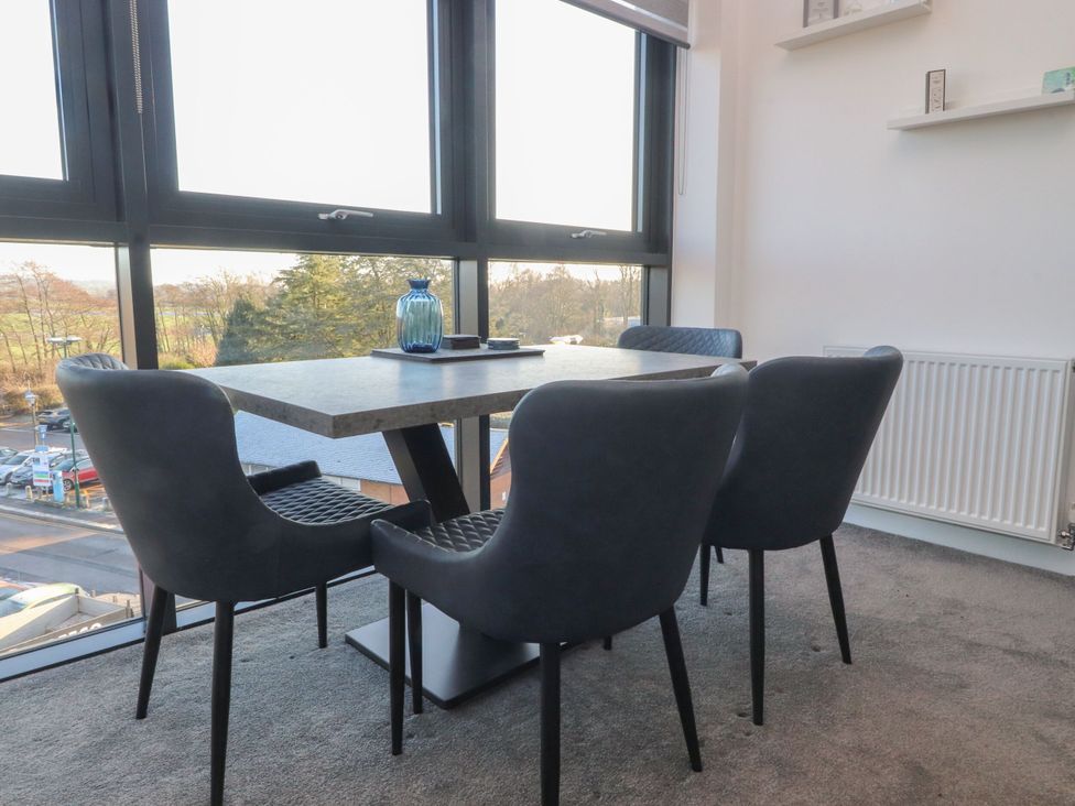 A dining room with a table and chairs at Apartment 20, River View in Preston