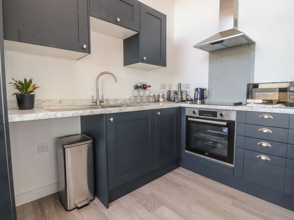 A kitchen with a sink and oven at Apartment 20, River View in Preston