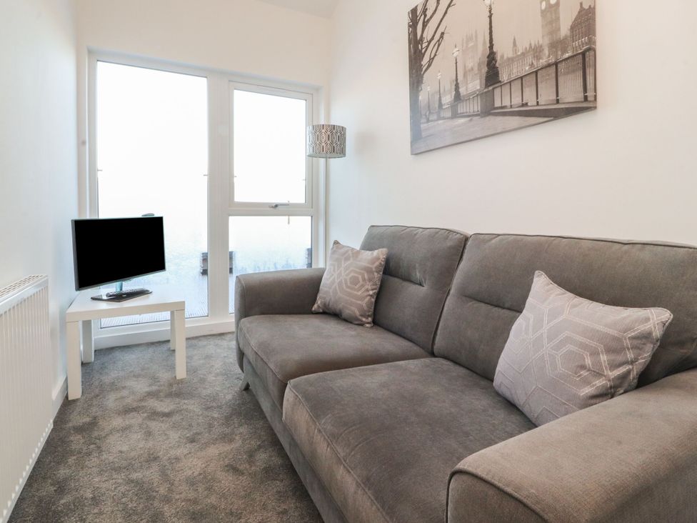 A living room with a sofa and television at Apartment 20, River View in Preston