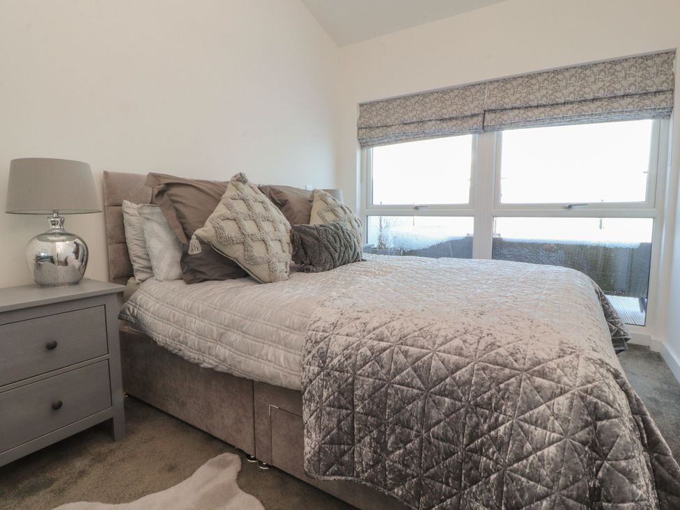 A bedroom with a bed and nightstand at Apartment 20, River View in Preston