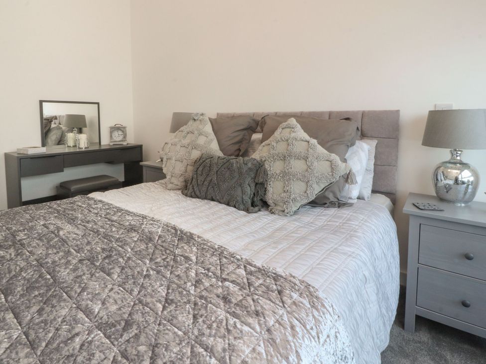 A bedroom with a bed and a bedside table at Apartment 20, River View in Preston