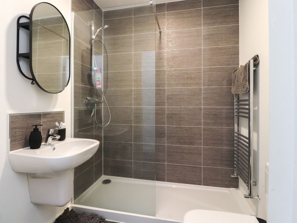 A bathroom with a shower and sink at Apartment 20, River View in Preston