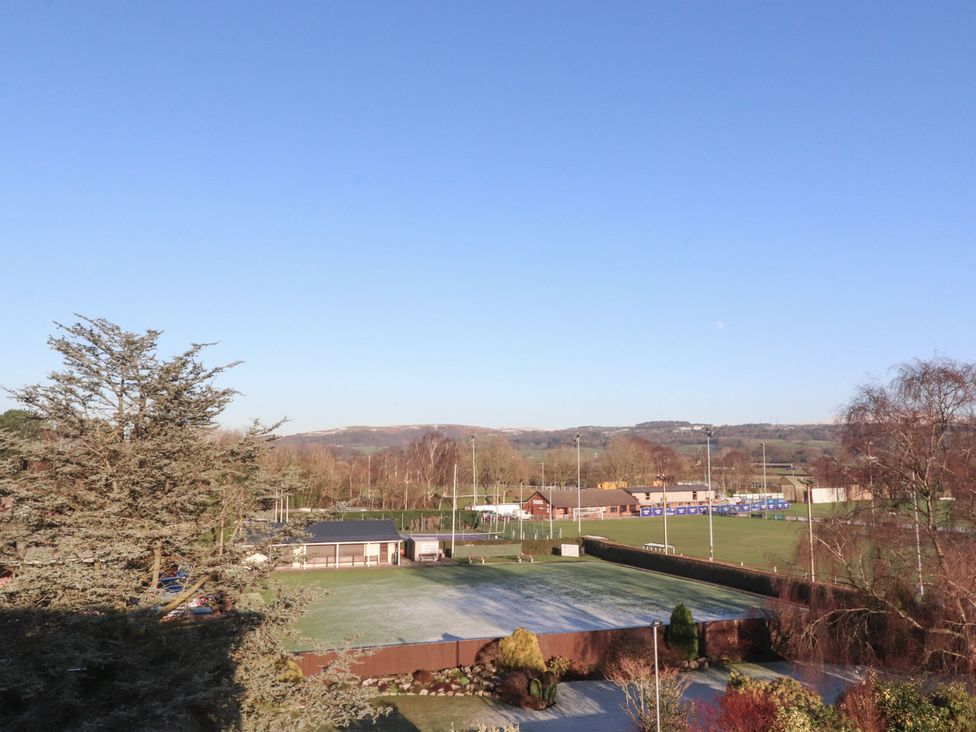 An outdoor view of a sports field and trees at Apartment 20, River View in Preston