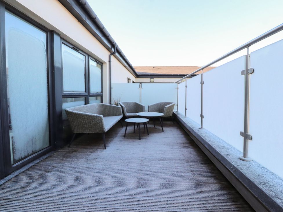 A balcony with chairs and a table at Apartment 20, River View in Preston