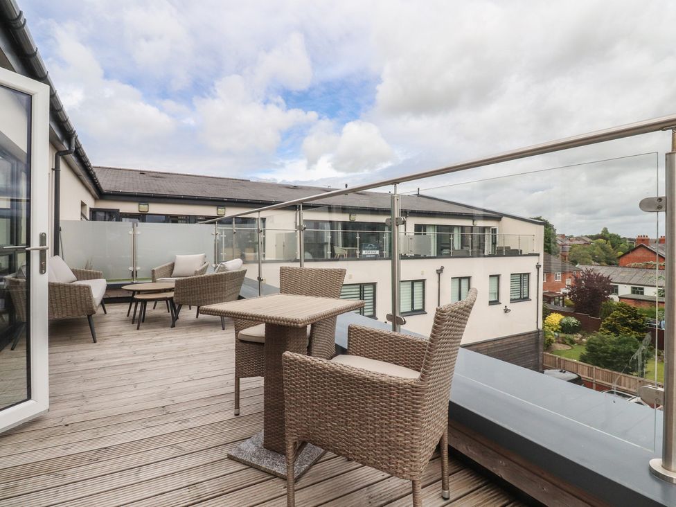 A balcony with chairs and a table at Apartment 20, River View, Garstang