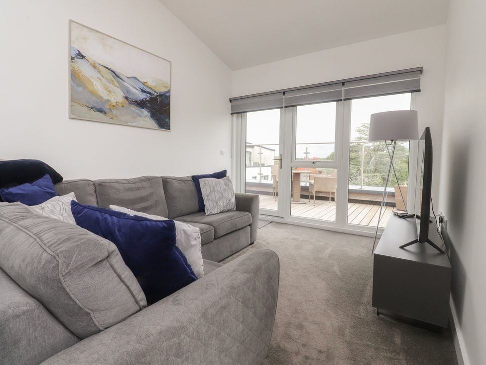 A living room with a sofa and television at Apartment 20, River View in Garstang