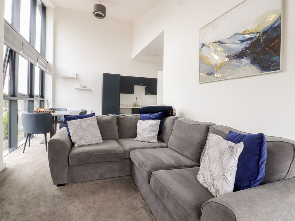 A living room with a sofa and coffee table at Apartment 20, River View Garstang
