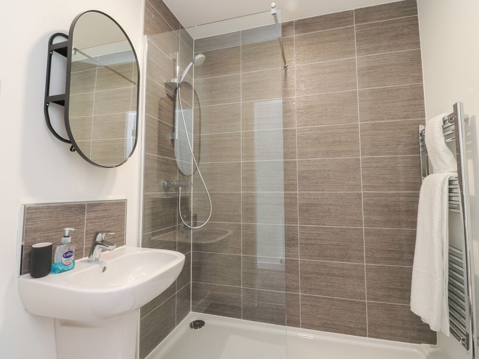 A bathroom with a shower and sink at Apartment 20, River View in Garstang