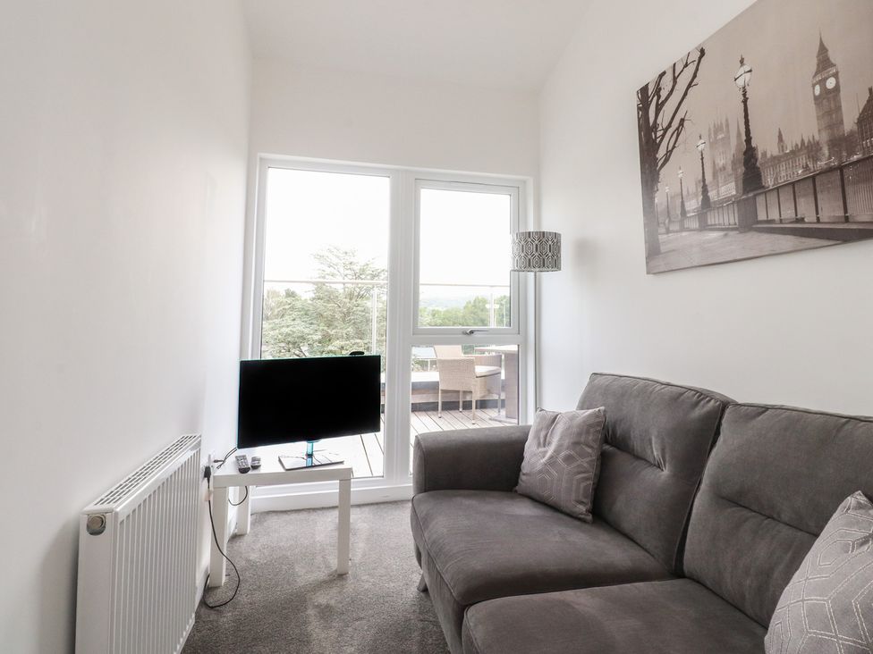 A living room with a sofa and television at Apartment 20, River View in Garstang