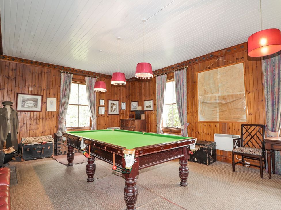 A snug with a billiard table and decor at Druidaig Lodge in Kyle