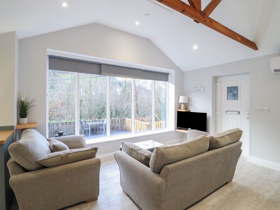 A living room with a couch and coffee table at Lodge at Nadur