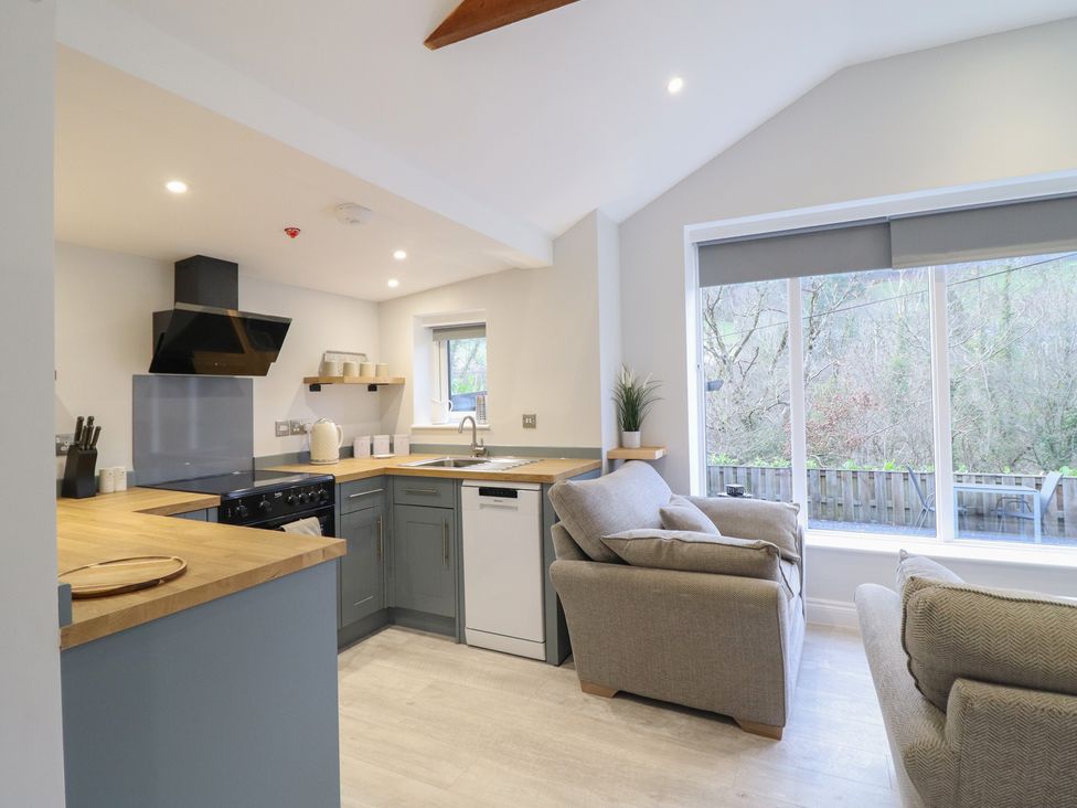 A kitchen with appliances and seating at Lodge at Nadur