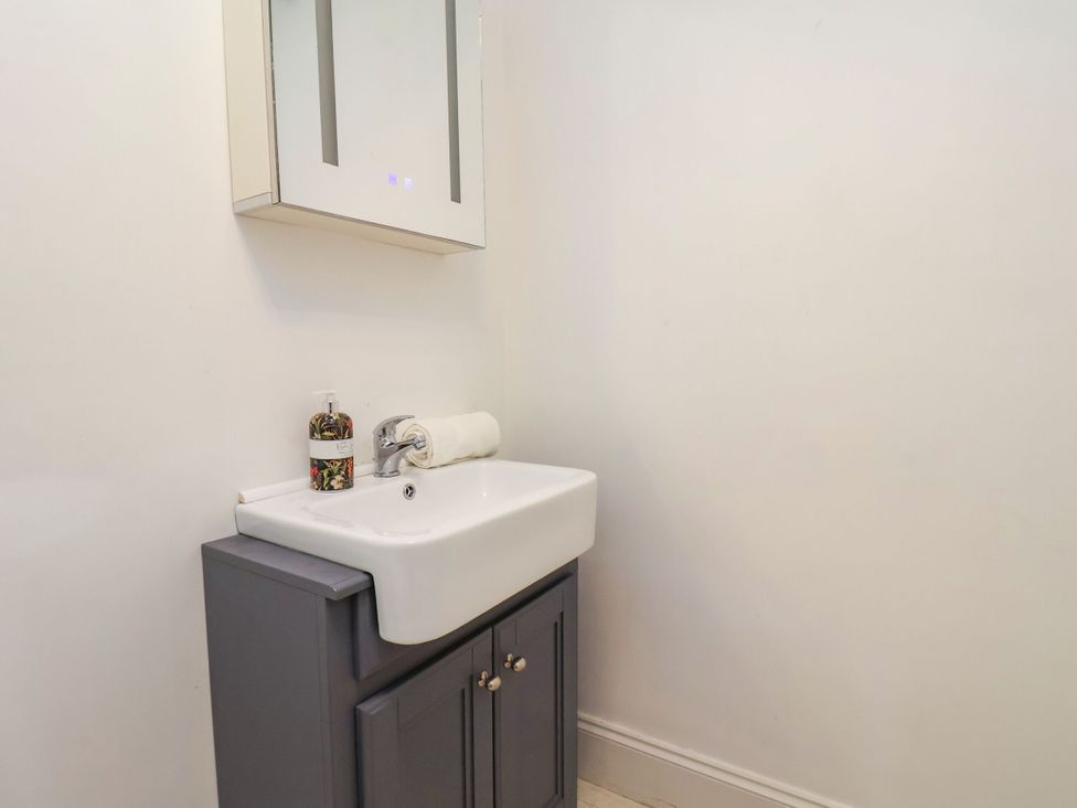 A bathroom with a sink and mirror at Sunnyvale House in Whitby