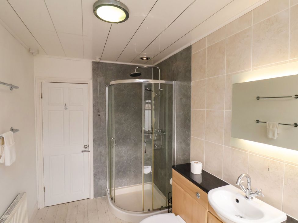 A bathroom with a shower and sink at Sunnyvale House in Whitby