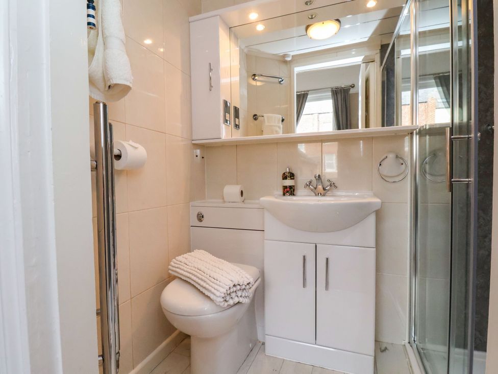 A bathroom with a shower and sink at Sunnyvale House in Whitby