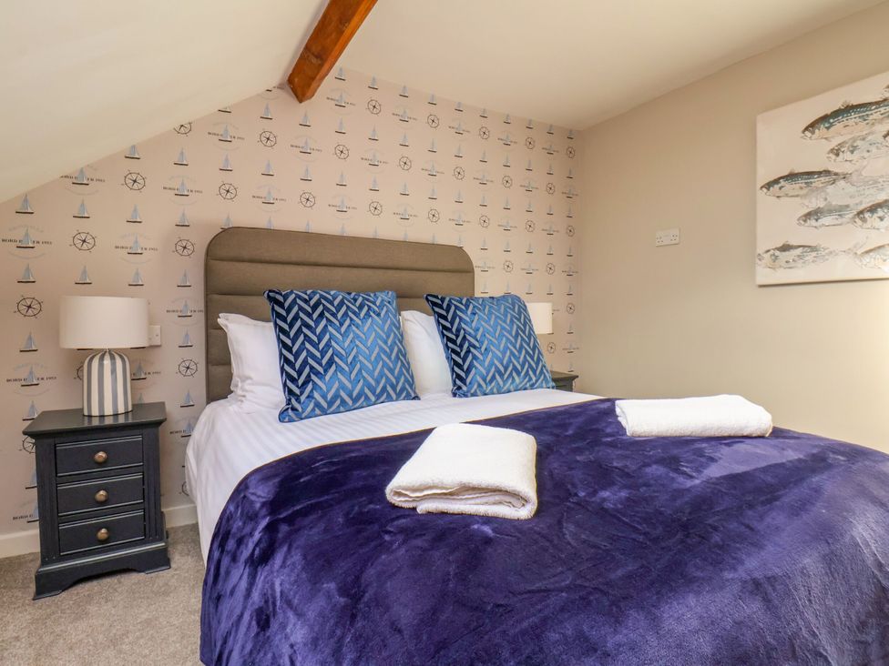 A bedroom with a bed and bedside table at Sunnyvale House in Whitby