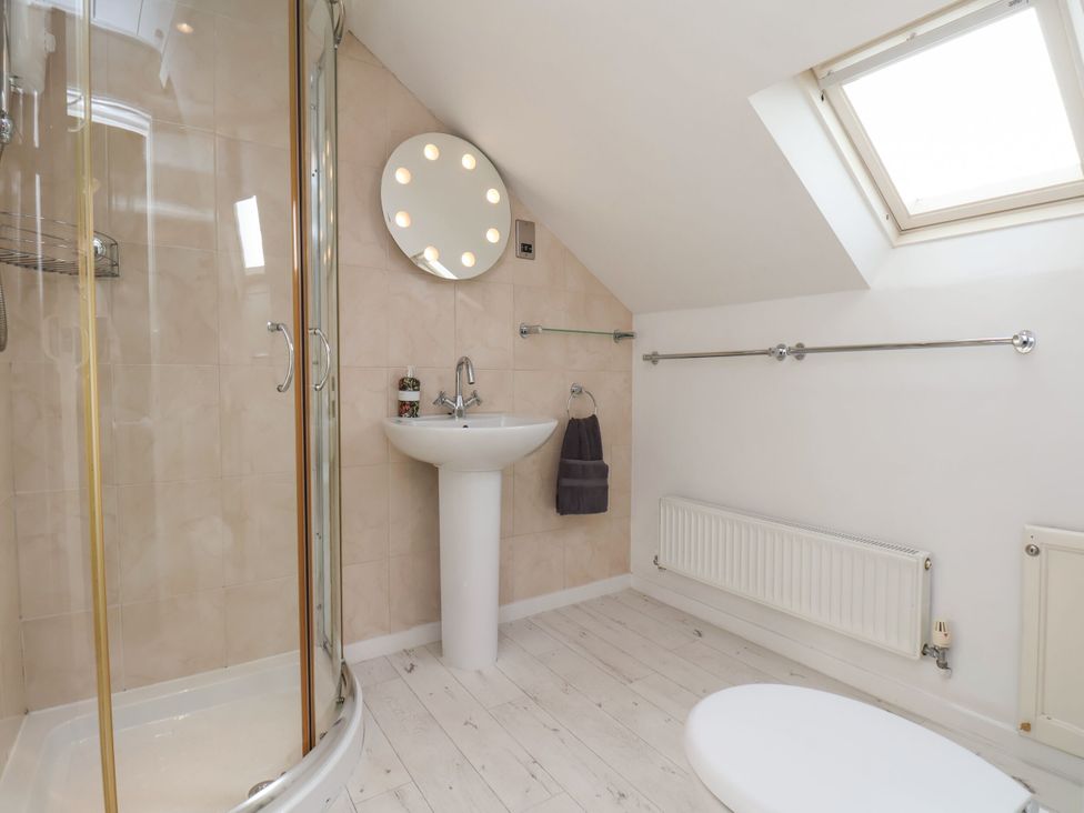 A bathroom with a shower and sink at Sunnyvale House in Whitby