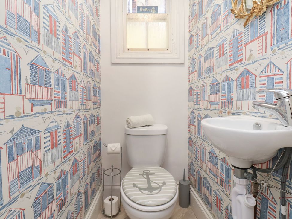 A bathroom with a toilet and hand basin at Sunnyvale House in Whitby