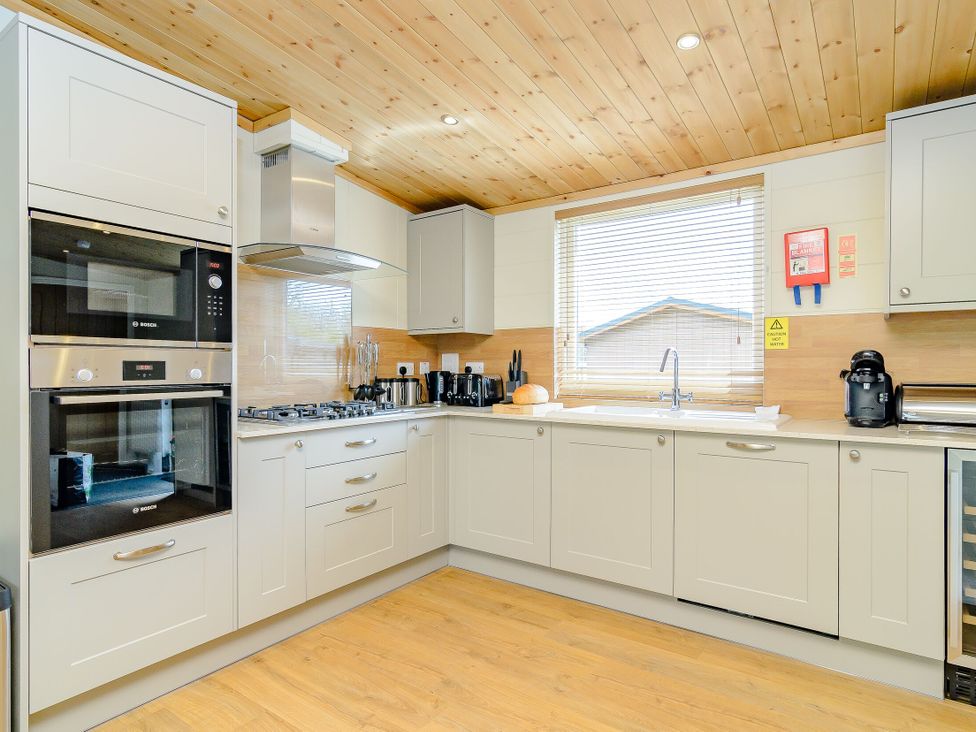 A kitchen with appliances and countertops at The Fotheringhay in Kings Cliffe