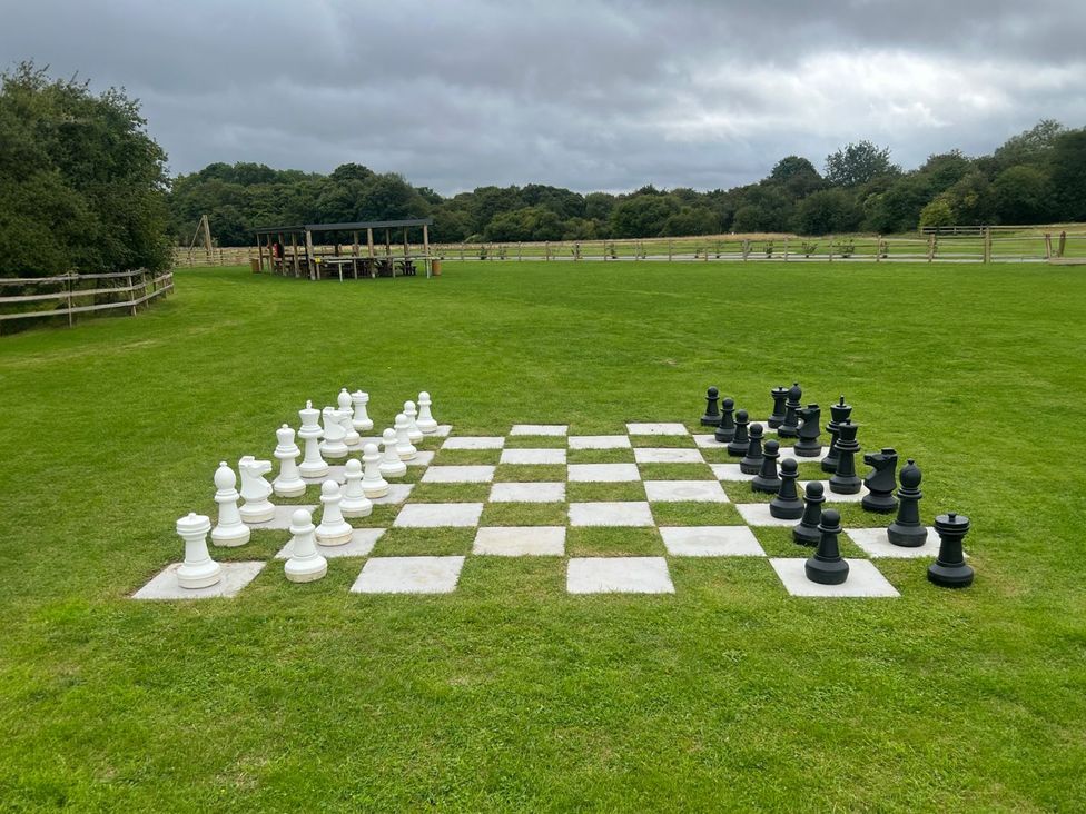 A large chess set on grass at The Fotheringhay (Pet) in Kings Cliffe