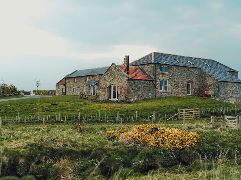 A house with a garden and pathway at The Old Watermill in Beadnell