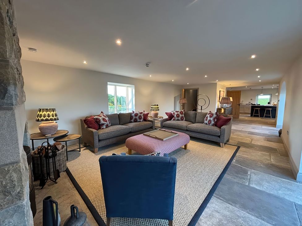 A living room with sofas and a coffee table at The Old Watermill Beadnell