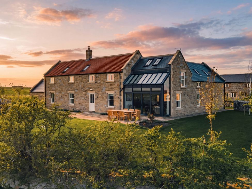 A house with garden furniture at The Old Watermill in Beadnell