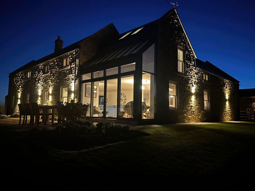A house exterior with outdoor lighting at Mill Farm House Beadnell