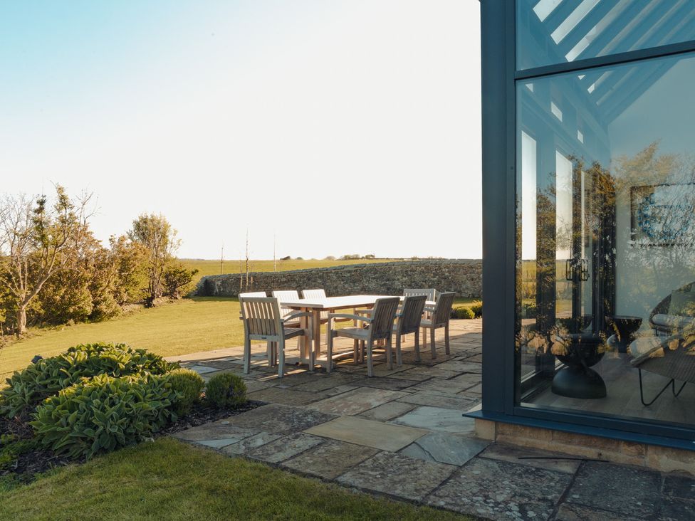 A garden with a patio set at Mill Farm House Beadnell