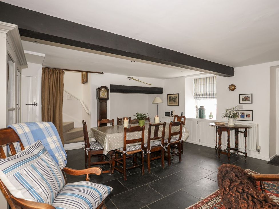 A dining room with a table and chairs at Bryn Tegid in Beaumaris