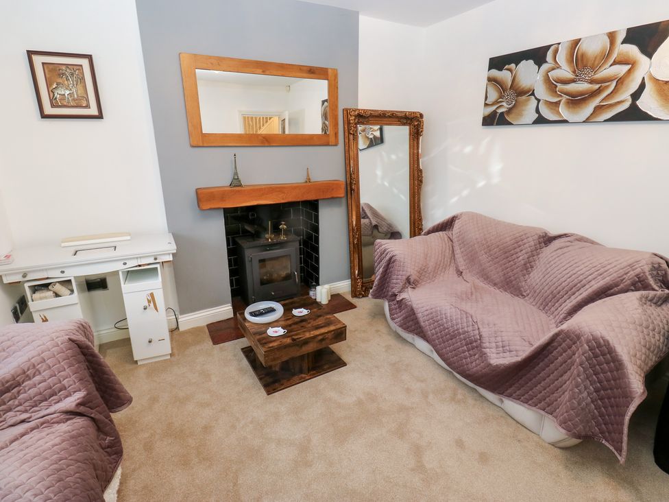 A living room with a sofa and coffee table at Middleton Park House in Leeds