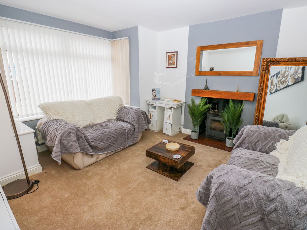 A living room with sofas and a coffee table at Middleton Park House in Leeds