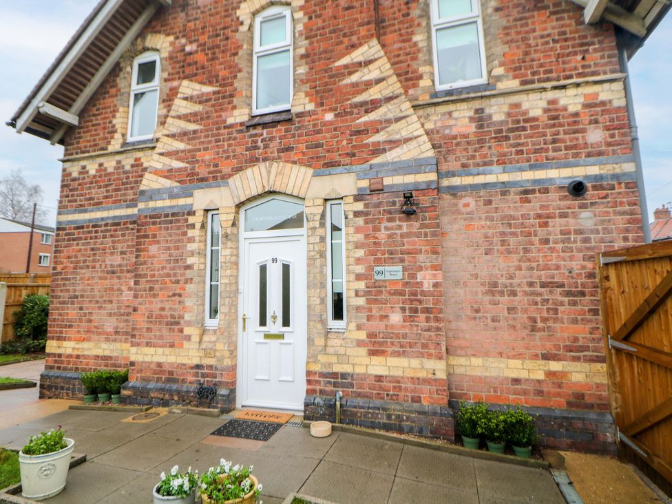 The front facade of a house with a door and windows at Nightingale House in Stafford